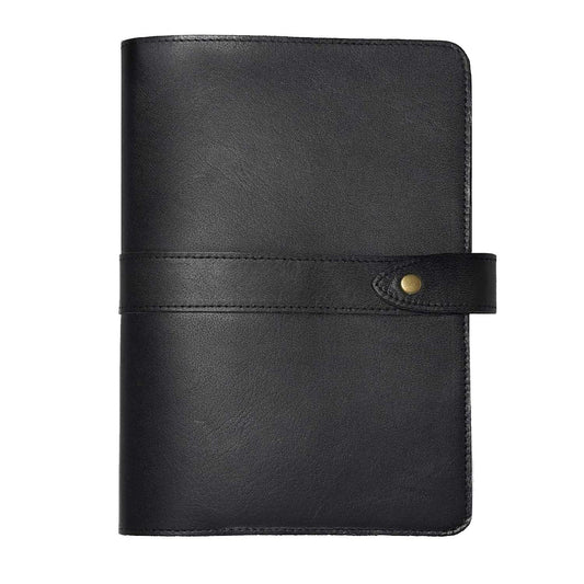 Black leather notebook cover with a brass snap closure on a white background